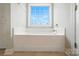 Bathroom featuring white walls and cabinets, as well as tile floors and lots of natural light at 3256 Fairmead Dr, Concord, NC 28025