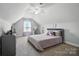 Comfortable bedroom with a plush bed, workspace, and storage unit at 3256 Fairmead Dr, Concord, NC 28025