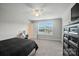 Bright bedroom features a ceiling fan, neutral walls, and a sunlit window at 3256 Fairmead Dr, Concord, NC 28025