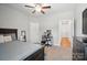 Bedroom featuring a bed, TV, and desk area, as well as neutral walls and lots of natural light at 3256 Fairmead Dr, Concord, NC 28025