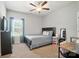 Bedroom featuring a bed, TV, and desk area, as well as neutral walls and lots of natural light at 3256 Fairmead Dr, Concord, NC 28025