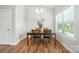Dining room features a wood table, modern chairs, and natural light at 3256 Fairmead Dr, Concord, NC 28025
