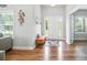 Bright foyer with hardwood floors, a bench, and decorative wall art at 3256 Fairmead Dr, Concord, NC 28025