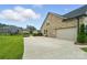 Spacious two-car garage with a long driveway and brick siding at 3256 Fairmead Dr, Concord, NC 28025