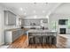 Modern kitchen features gray cabinets, a granite island, and stainless steel appliances at 3256 Fairmead Dr, Concord, NC 28025