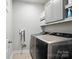 Functional laundry room with modern washer and dryer units at 3256 Fairmead Dr, Concord, NC 28025