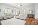 Inviting living room with neutral tones, stylish sofas, and ample natural light from large windows at 3256 Fairmead Dr, Concord, NC 28025