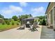 Outdoor patio with sleek seating, fire pit, and manicured landscaping at 3256 Fairmead Dr, Concord, NC 28025