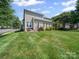 A large backyard with mature trees, green grass, and lots of room for fun at 3301 Old Knobbley Oak Dr, Gastonia, NC 28056