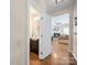 A half bath featuring wood floors, modern fixtures, and neutral walls at 3301 Old Knobbley Oak Dr, Gastonia, NC 28056