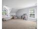 Large bedroom with carpeted floors, walk in closet, vaulted ceiling and ensuite bathroom at 3301 Old Knobbley Oak Dr, Gastonia, NC 28056