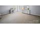 Spacious bedroom with carpeted floors, neutral walls, and ample natural light from the window at 3301 Old Knobbley Oak Dr, Gastonia, NC 28056