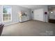 Bedroom featuring carpeted floor and light gray walls with a double door closet at 3301 Old Knobbley Oak Dr, Gastonia, NC 28056