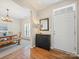 Inviting foyer with hardwood floors, an antique cabinet, and a view into the dining area at 3301 Old Knobbley Oak Dr, Gastonia, NC 28056