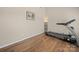 A home gym featuring wood floors and neutral walls at 3301 Old Knobbley Oak Dr, Gastonia, NC 28056