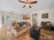 Open living space featuring hardwood floors and seamless access to the breakfast area at 3301 Old Knobbley Oak Dr, Gastonia, NC 28056