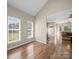 Open living area with hardwood floors, lots of light, and an open floor plan at 3301 Old Knobbley Oak Dr, Gastonia, NC 28056