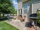 Cozy patio area with grill, chairs, and access to the home. Great for outdoor entertaining at 3301 Old Knobbley Oak Dr, Gastonia, NC 28056