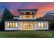 Stunning backyard view of the house with covered patio and well manicured lawn at 3308 Carmel Rd, Charlotte, NC 28226