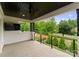 Spacious balcony with a ceiling fan and views of the greenery and front yard at 3308 Carmel Rd, Charlotte, NC 28226