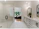 Bathroom featuring a walk-in glass shower and an ensuite with double vanity and black hardware at 3308 Carmel Rd, Charlotte, NC 28226