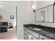 Bathroom vanity with black granite countertops and view into the bedroom at 3308 Carmel Rd, Charlotte, NC 28226