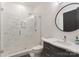 Bathroom with a glass-enclosed shower, marble tile, and modern vanity at 3308 Carmel Rd, Charlotte, NC 28226