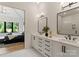 Ensuite bathroom with double vanity, black hardware, and direct access to the main bedroom at 3308 Carmel Rd, Charlotte, NC 28226