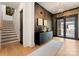 Elegant foyer boasts hardwood floors, a modern light fixture, and a stylish console table with artwork at 3308 Carmel Rd, Charlotte, NC 28226