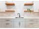 A bright kitchen with open shelving, subway tiles and light countertops at 3308 Carmel Rd, Charlotte, NC 28226