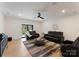 Comfortable living room with large seating area, ceiling fan, and round coffee table on a decorative area rug at 3308 Carmel Rd, Charlotte, NC 28226