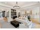 Open-concept living room with view of kitchen and built-in bar at 3308 Carmel Rd, Charlotte, NC 28226