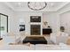 Bright living room with fireplace, chandelier, and large window at 3308 Carmel Rd, Charlotte, NC 28226