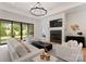 Bright living room featuring fireplace, chandelier, and sliding glass door at 3308 Carmel Rd, Charlotte, NC 28226