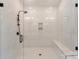 Modern walk-in shower with black hardware, marble tiling, and convenient built-in bench at 3308 Carmel Rd, Charlotte, NC 28226