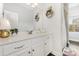 This modern bathroom vanity is white with new fixtures at 3332 Katherine Taylor Ct, Monroe, NC 28110