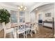 Dining room with hardwood floors, chandelier, and ample natural light at 3332 Katherine Taylor Ct, Monroe, NC 28110