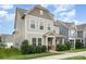 Attractive two-story home with a covered porch, manicured landscaping, and abundant natural light at 3332 Katherine Taylor Ct, Monroe, NC 28110