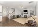 Cozy living room featuring a fireplace, hardwood floors, and neutral color palette at 3332 Katherine Taylor Ct, Monroe, NC 28110