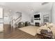 Spacious living room with fireplace, hardwood floors, and plenty of natural light at 3332 Katherine Taylor Ct, Monroe, NC 28110