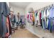 A spacious walk-in closet is neatly arranged with clothing racks and shoe shelves at 3332 Katherine Taylor Ct, Monroe, NC 28110
