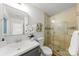 Bathroom featuring a walk-in shower with glass enclosure and a modern vanity with decorative plant at 3519 Campbell Dr, Charlotte, NC 28205