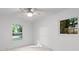 Well-lit bedroom features dual windows, neutral carpet, and fresh white paint at 3519 Campbell Dr, Charlotte, NC 28205