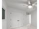 Bright bedroom with windows, featuring neutral carpet and a closet with double doors at 3519 Campbell Dr, Charlotte, NC 28205
