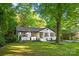 Charming home with a well-manicured front lawn and mature trees at 3519 Campbell Dr, Charlotte, NC 28205