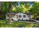 Charming home with a landscaped front yard and a mature tree at 3519 Campbell Dr, Charlotte, NC 28205