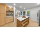 Open concept kitchen features a spacious island, ample storage, and seamless flow to the living area at 3519 Campbell Dr, Charlotte, NC 28205