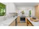 Bright kitchen with quartz countertops, stainless appliances, and eat-in island at 3519 Campbell Dr, Charlotte, NC 28205