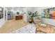 Sunlit living room showcases stylish furnishings, a bright kitchen and open floor plan for easy living at 3519 Campbell Dr, Charlotte, NC 28205