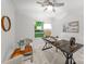 Well-lit home office featuring a large desk, comfortable seating, and a view of the outdoors at 3519 Campbell Dr, Charlotte, NC 28205
